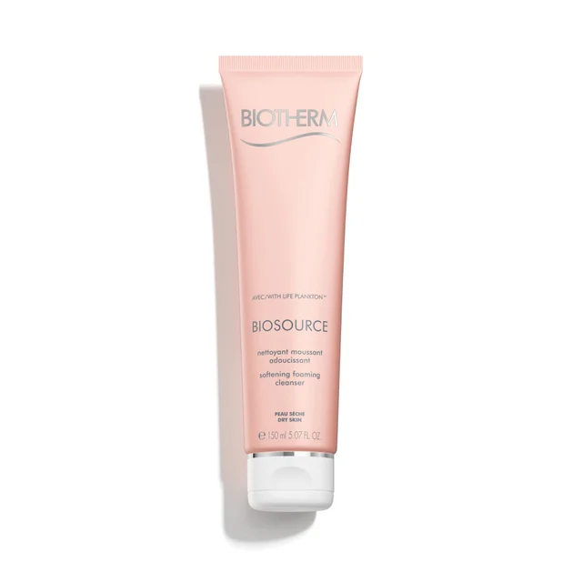 A light pink tube of Biotherm Biosource Softening Foaming Cleanser for dry skin, featuring a white flip-top cap and silver text, centered against a plain white background.