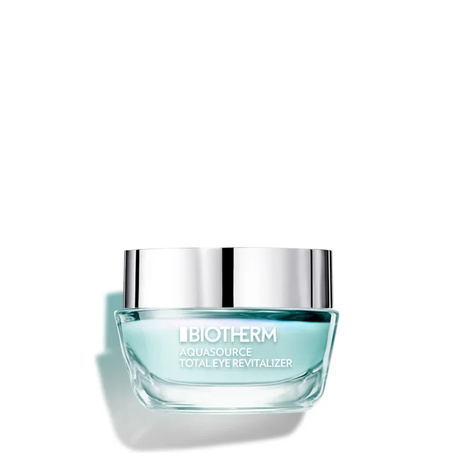A small, clear glass jar of Biotherm Aquasource Total Eye Revitalizer gel sits against a white background, featuring a silver lid and light blue-tinted product inside.