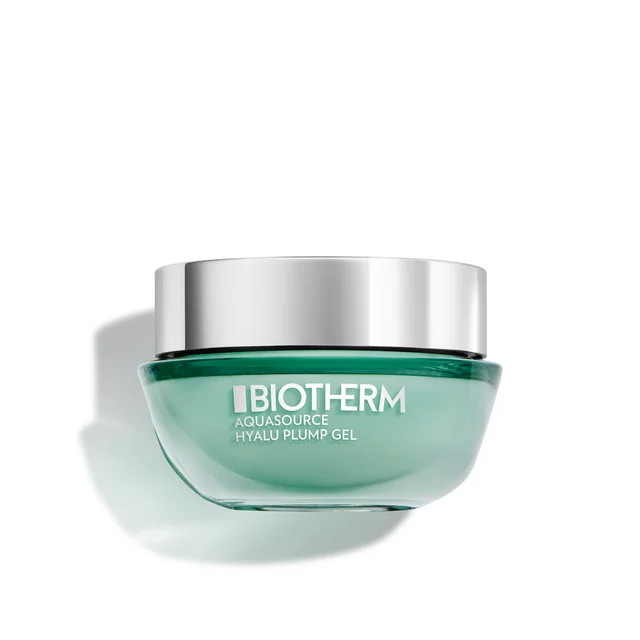 A jar of Biotherm Aquasource Hyalu Plump Gel moisturizer sits against a white background, featuring a translucent green glass base and a reflective silver screw-top lid.
